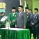 Sekretaris Jenderal PB Al Jam'iyatul Washliyah, Dr. Ir. H. Amran Arifin, MM, MBA, membacakan Surat Keputusan (SK) pengangkatan Prof. Dr. H. M. Jamil, MA, sebagai Rektor UNIVA Medan periode 2025-2029 di Convention Hall UNIVA, Medan, Selasa (18/3/2025). (Foto: ist/seputaranindonesia.com).